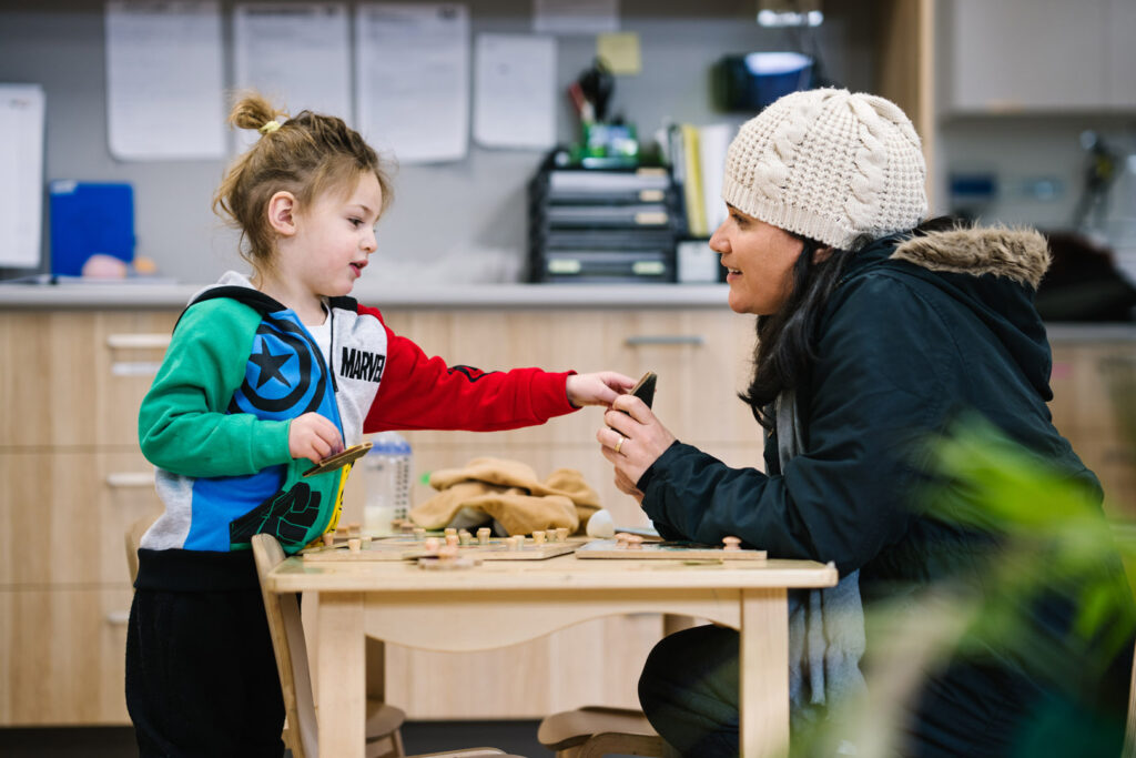 KU Maidstone childcare educator interacting with a child