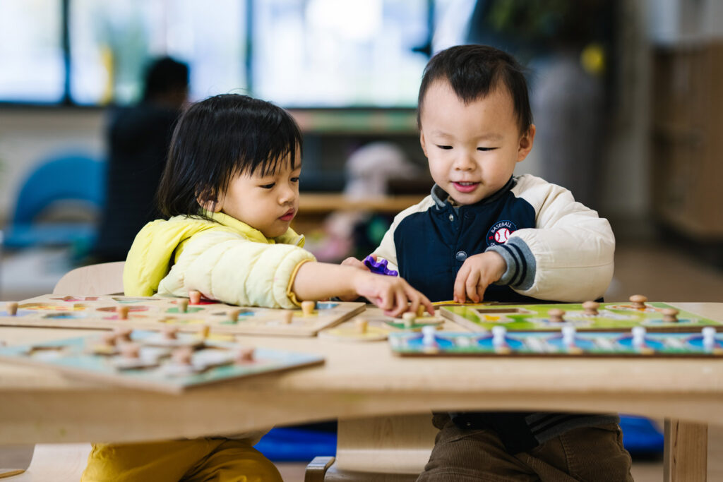 Children doing puzzles at KU Maidstone childcare