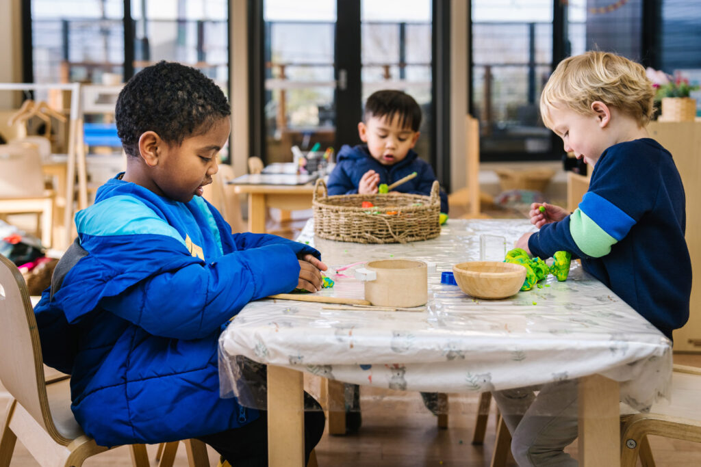 Children playing with playdough at KU Maidstone childcare