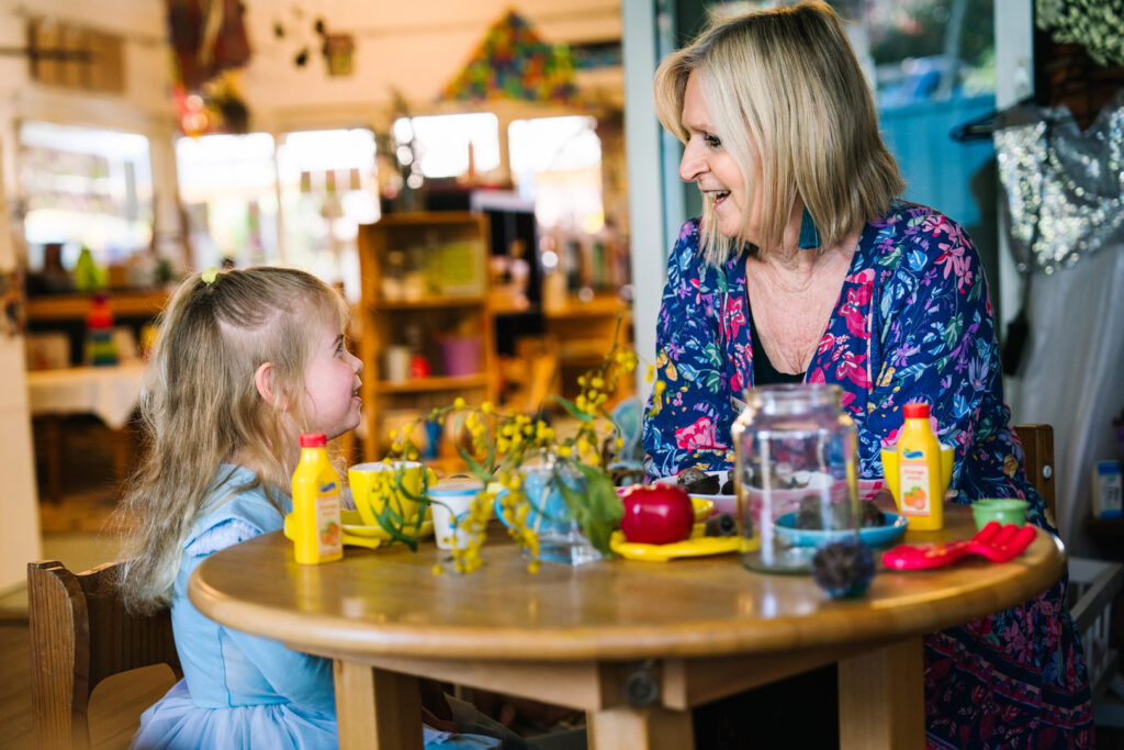 KU Bel Air childcare educator interacting with a child