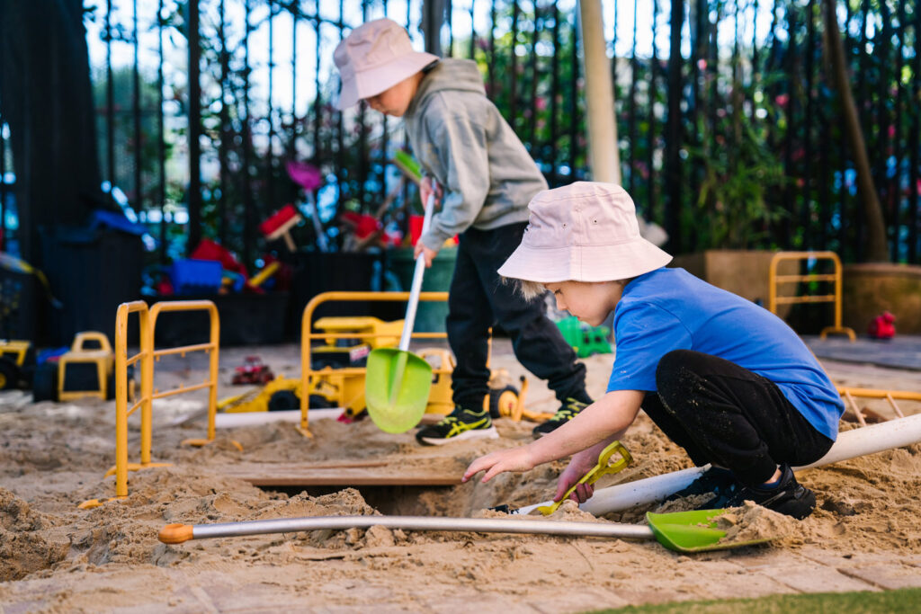 Children playing in the sand at KU Bel Air childcare