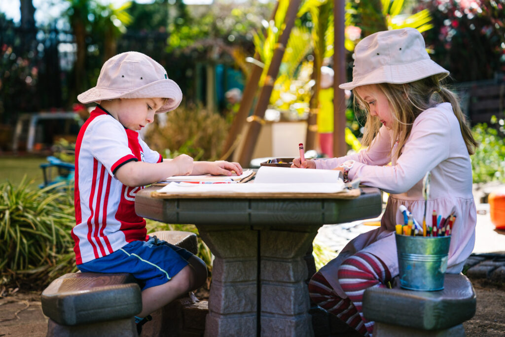 Children drawing pictures at KU Bel Air childcare