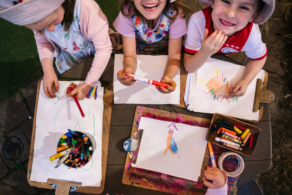 Children drawing pictures at KU Bel Air childcare