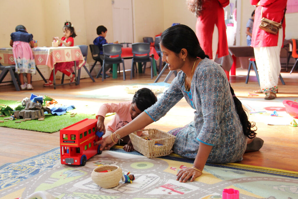 KU IWSP Ashfield childcare educator interacting with a child