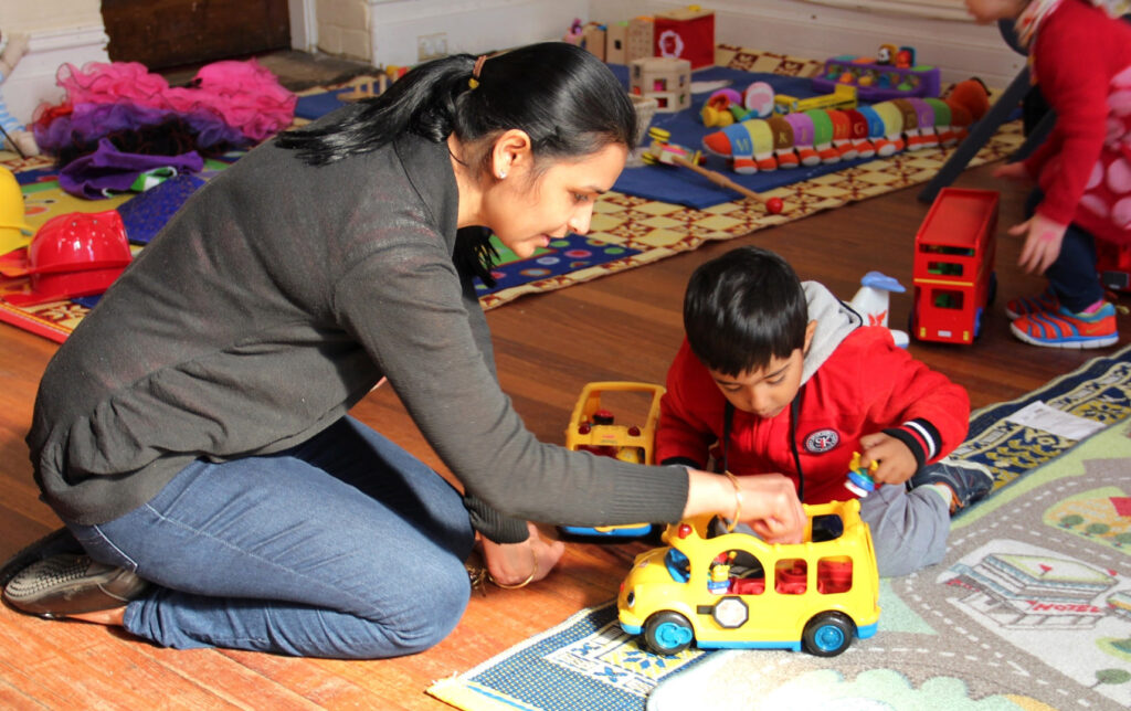 KU IWSP Ashfield childcare educator interacting with a child