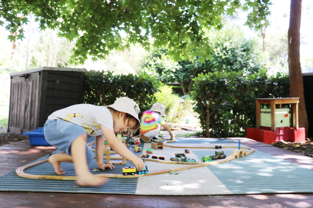 Children playing with trains at KU Avalon childcare