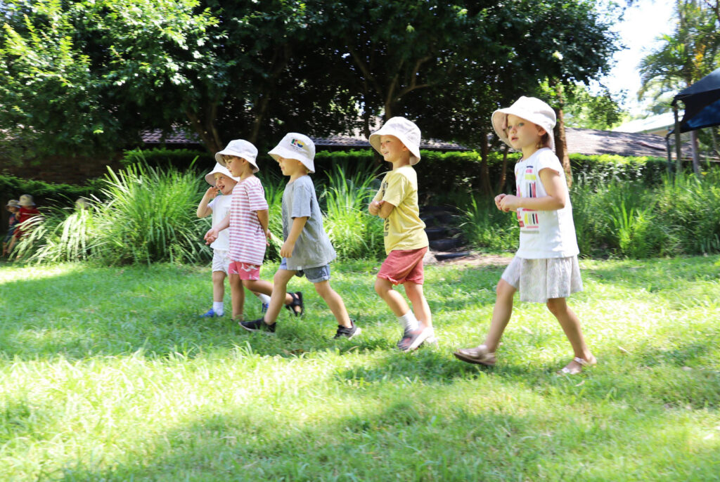 Children playing outdoors at KU Avalon childcare