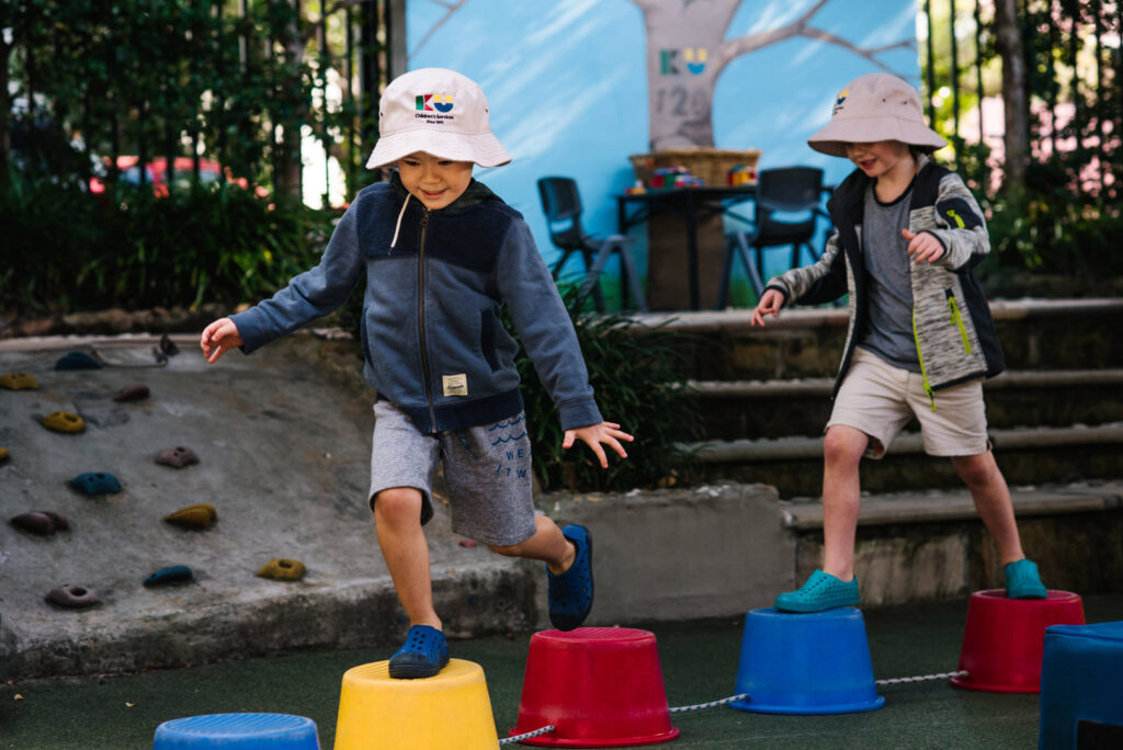 Children on stepping stones at KU Phoenix childcare