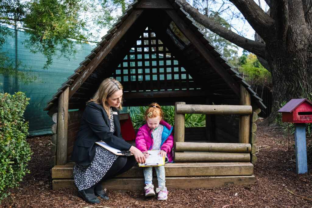 KU Berowra childcare educator interacting with a child