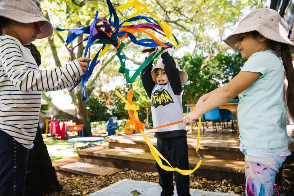 Children playing with ribbons at KU Burwood childcare