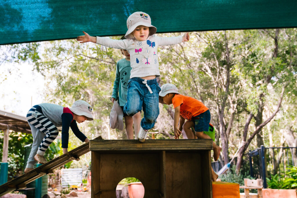 Children playing in the shade at Kooinda Workbase Childcare