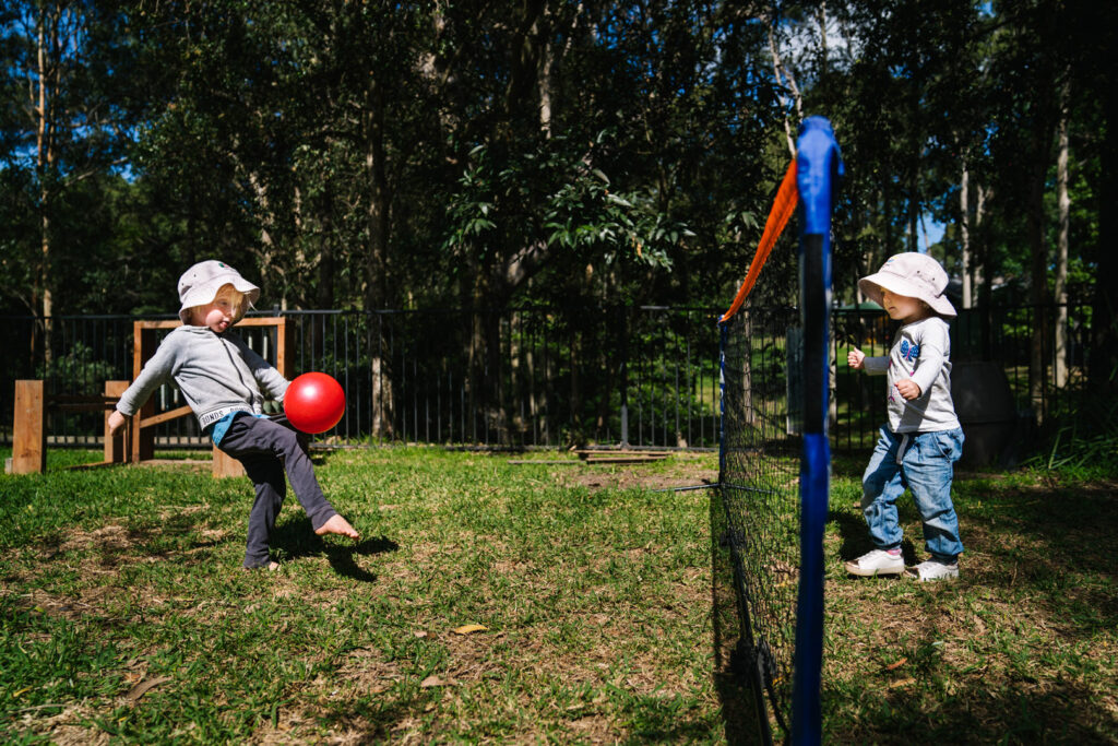 Children kicking a ball at Kooinda Workbase Childcare