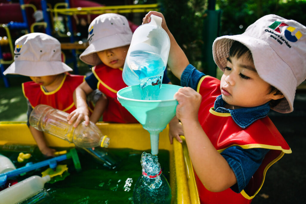 Children playing with water at KU Chatswood Community childcare