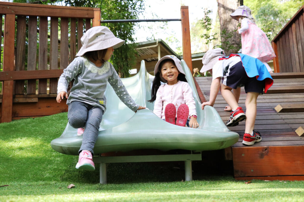 Children playing on the slides at KU Chatswood West childcare