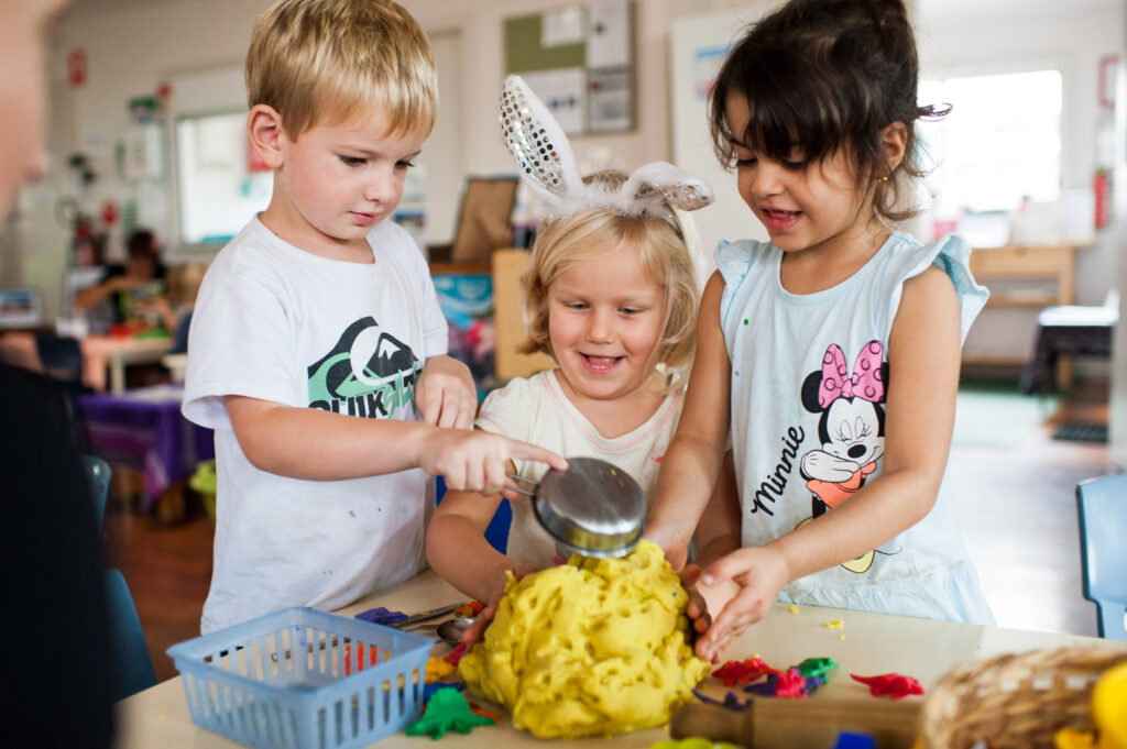 Children playing with playdough at KU Corrimal East childcare