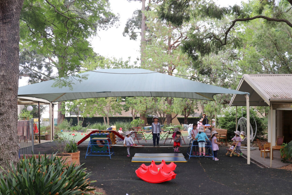 Children playing on equipment at KU Eastwood childcare