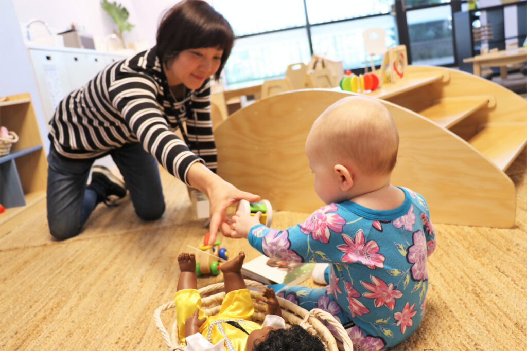 A Honey Bird Childcare educator interacting with a child