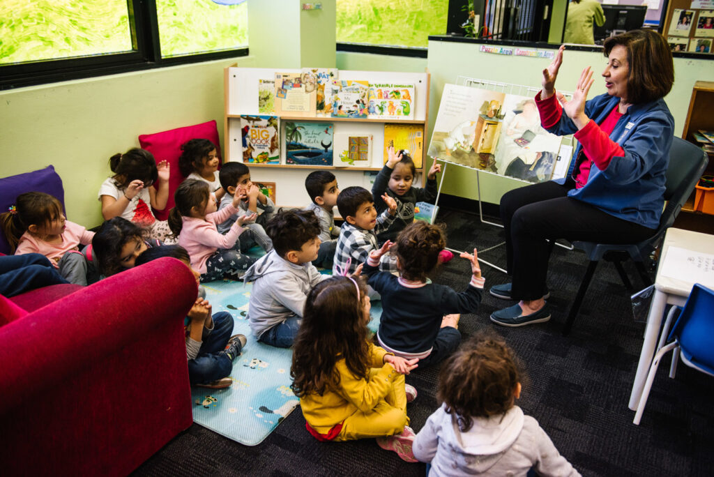 KU Fairfield AMEP childcare educator and children counting to ten