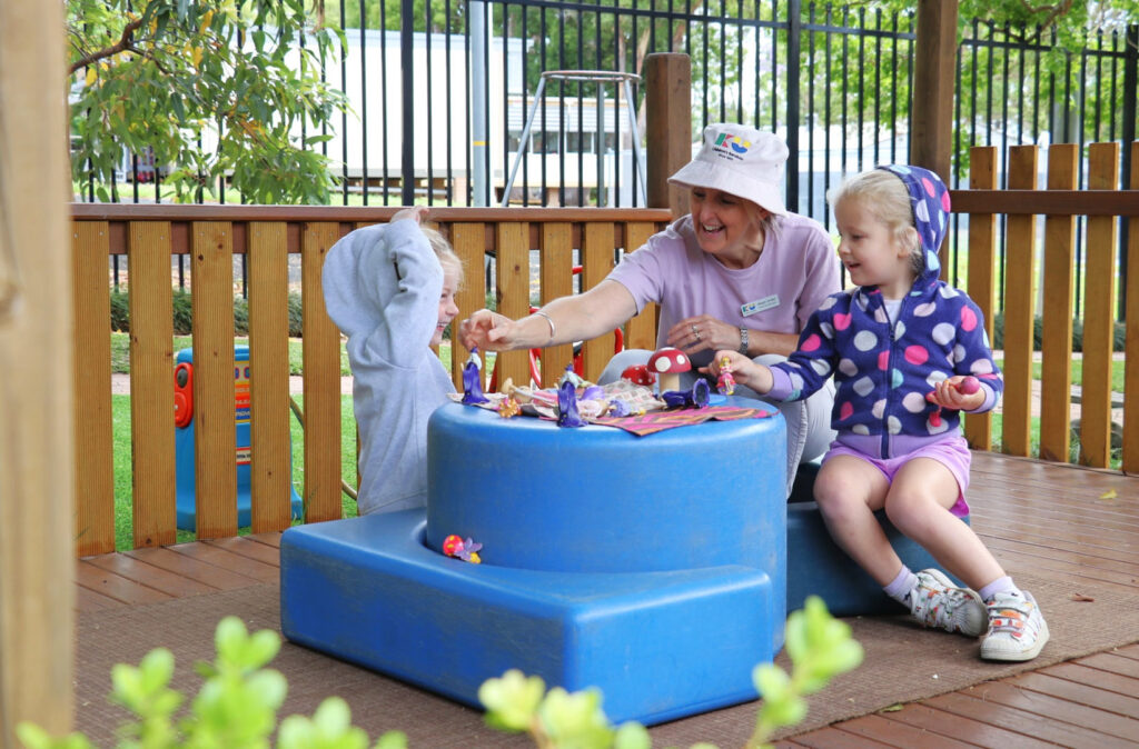 KU Galston childcare educator interacting with children