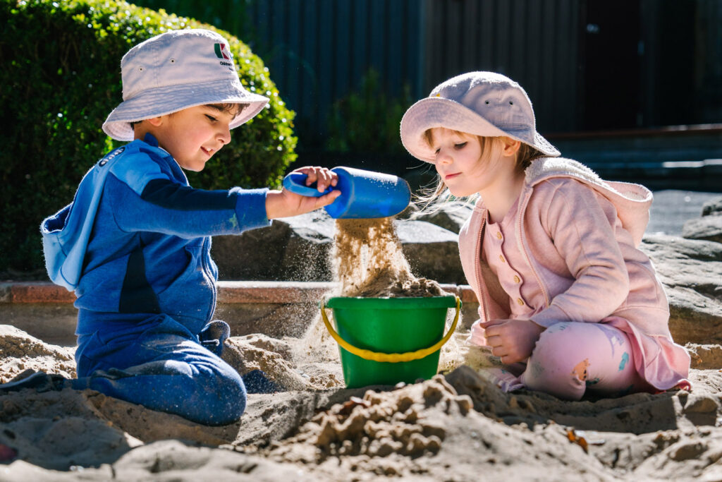 Children playing in the sand at KU Greenwich childcare