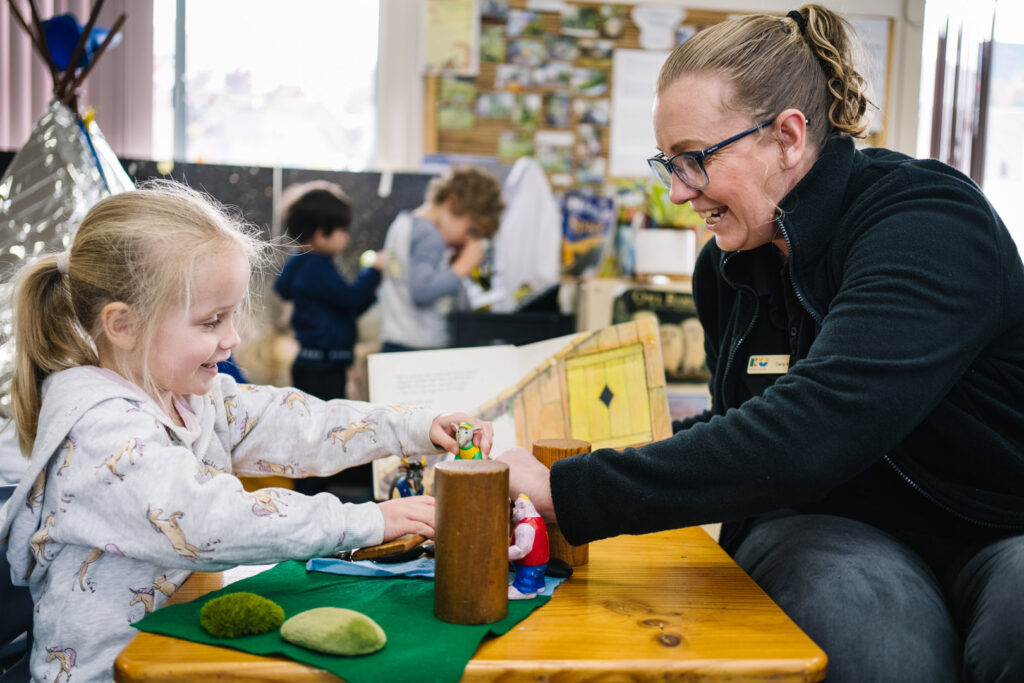 KU Gwynneville childcare educator interacting with a child