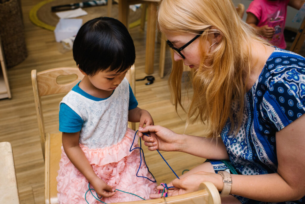 A Darling Nest educator interacting with a child