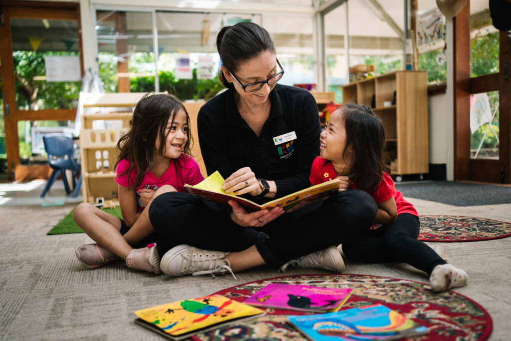 KU Hebersham childcare educator reading a story to children