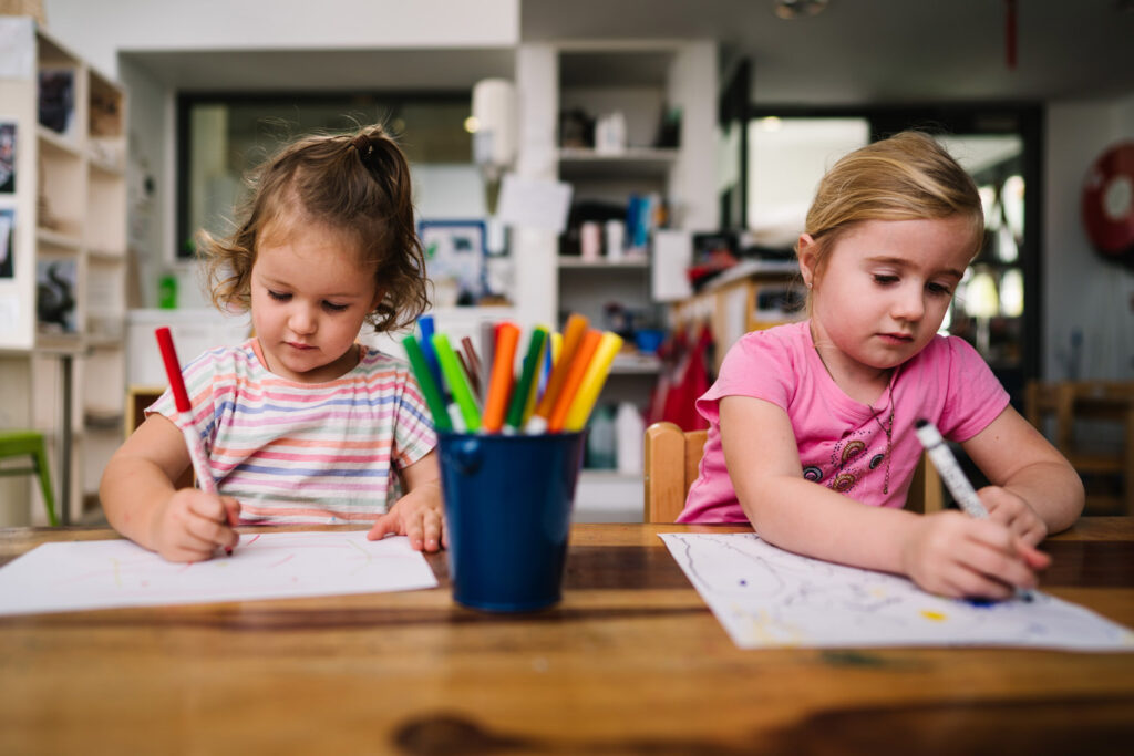 Children drawing pictures at KU Kahibah Road childcare