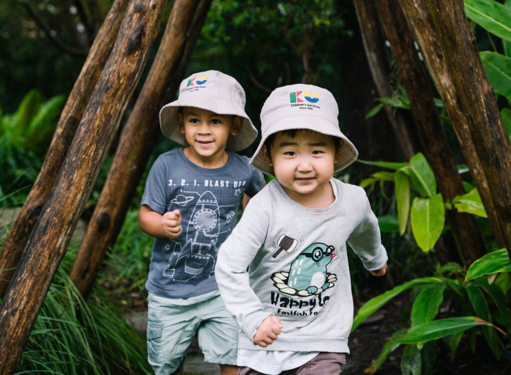 Children playing outdoors at KU Grevillea childcare