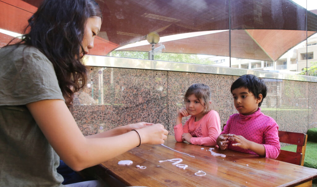 KU Kogarah childcare educator interacting with children