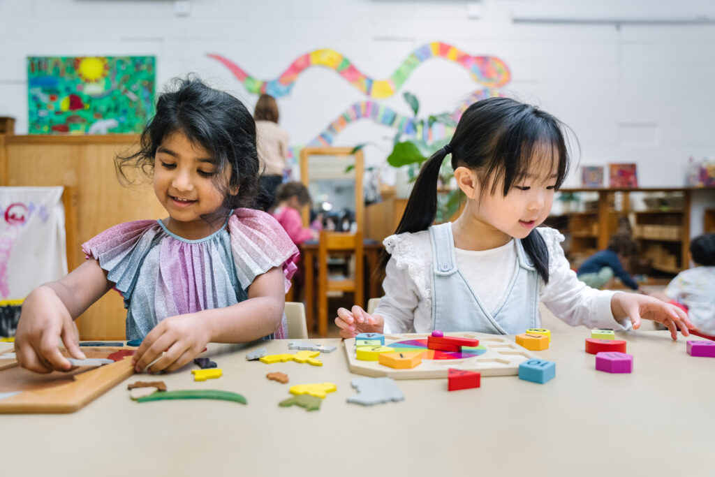 Children doing puzzles at KU Osborne childcare