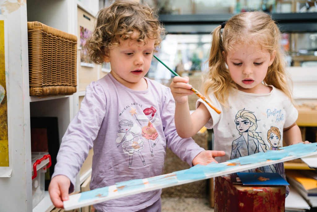 Children painting at KU ANSTO childcare