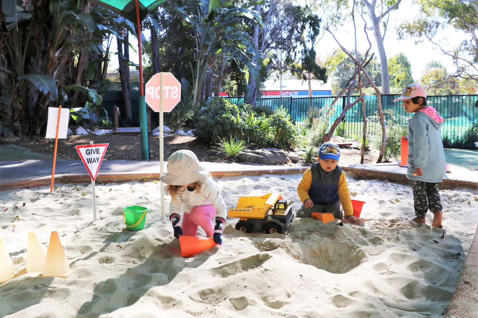 Children playing in the sand at KU Crusader childcare