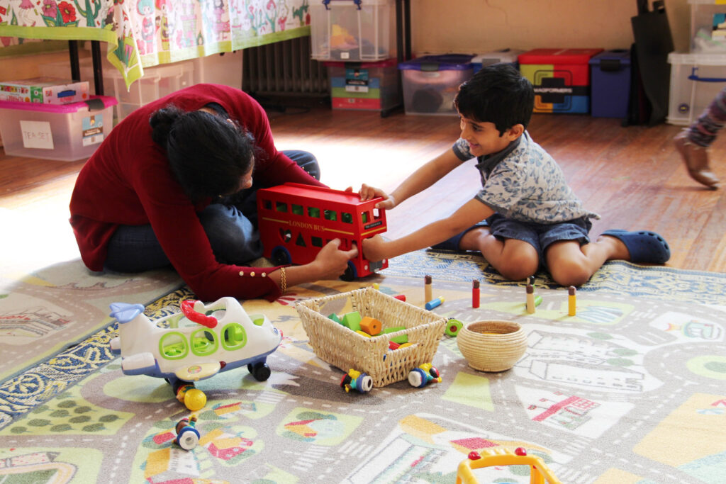 KU IWSP Marrickville childcare educator interacting with a child