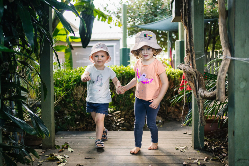 Children interacting outdoors at KU Mayfield childcare