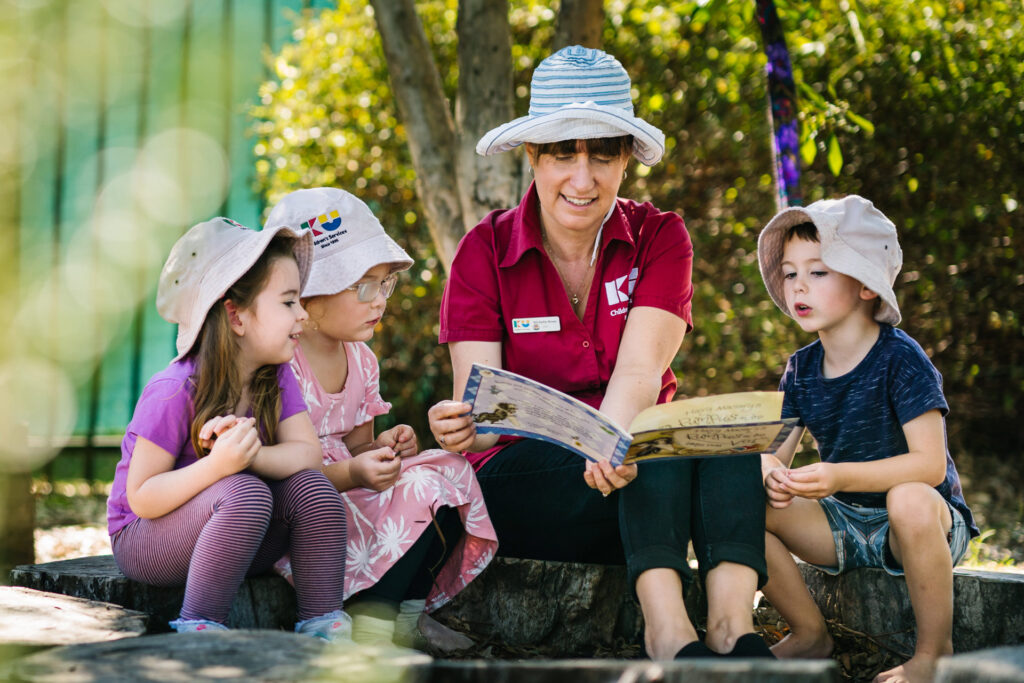 KU Milperra childcare educator reading to children