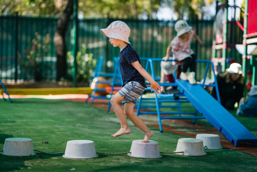 Child on the stepping stones at KU Merewether childcare