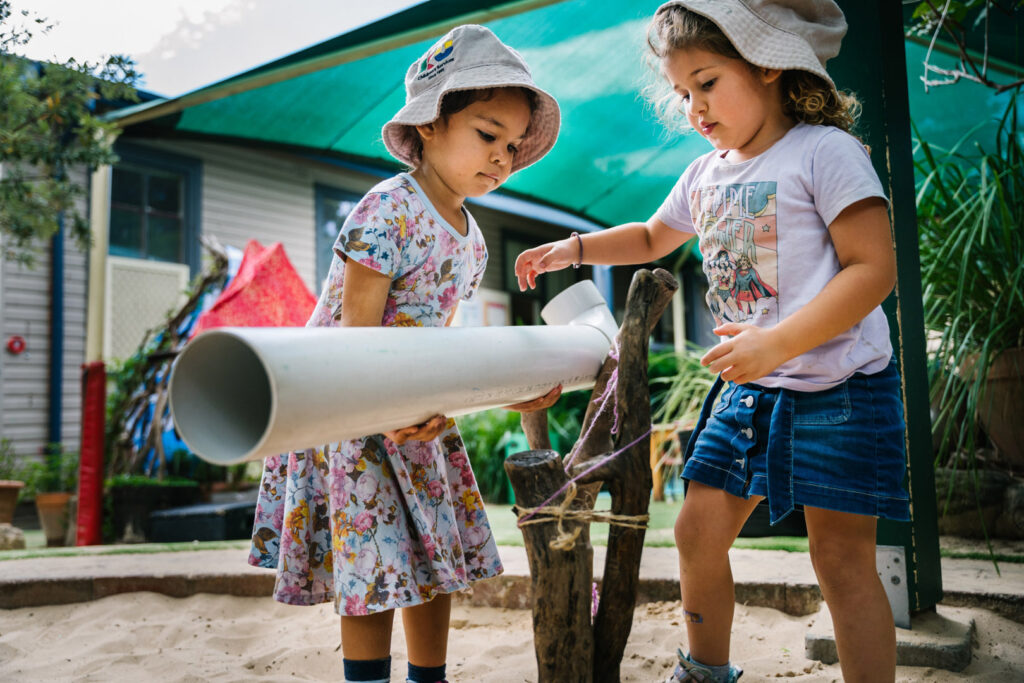 Children playing outdoors at KU Carillon Avenue childcare