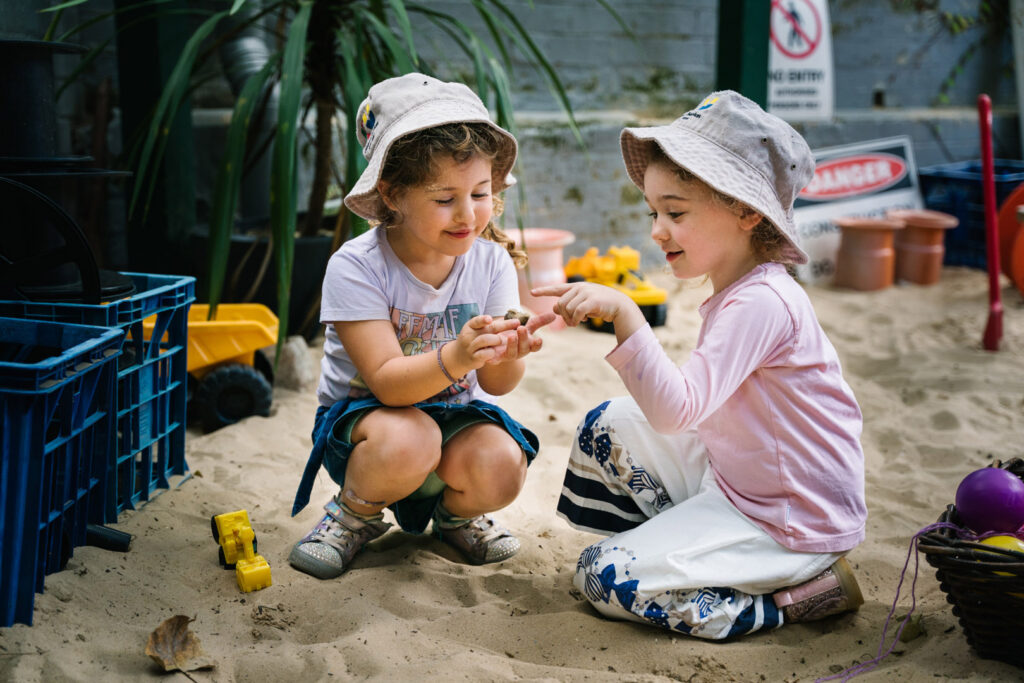 Children playing in the sand at KU Carillon Avenue childcare