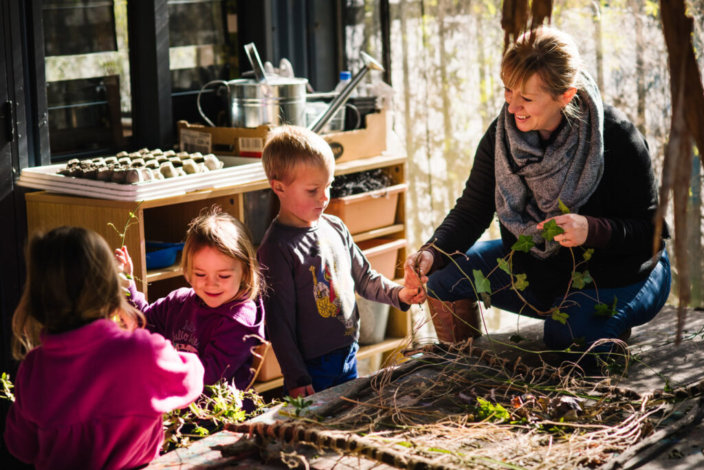 KU Bilya Gulyangarri childcare educator gardening with some children