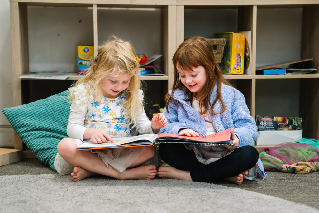 Children reading a story at KU North Ryde childcare