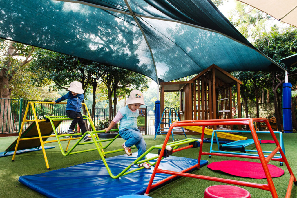 Children playing on equipment at KU Grandstand childcare