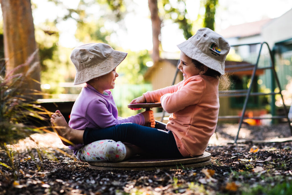 Children playing outdoors at KU Padstow childcare