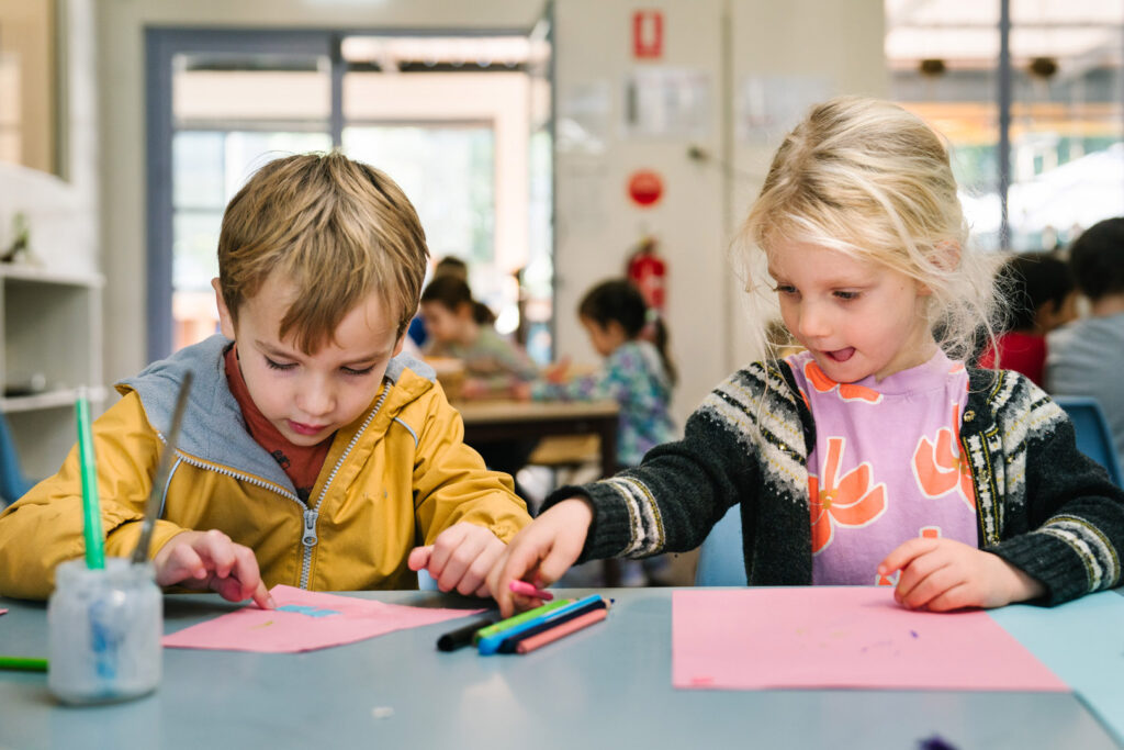 Children doing some drawings at KU Petersham childcare