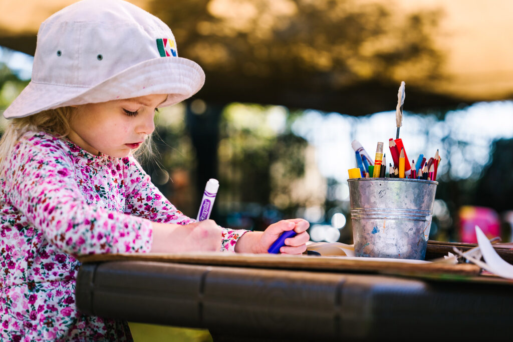 Child doing a drawing at KU St Ives Barra Brui childcare