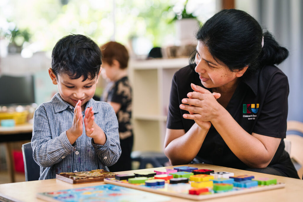 KU Sutherland childcare educator counting with a child