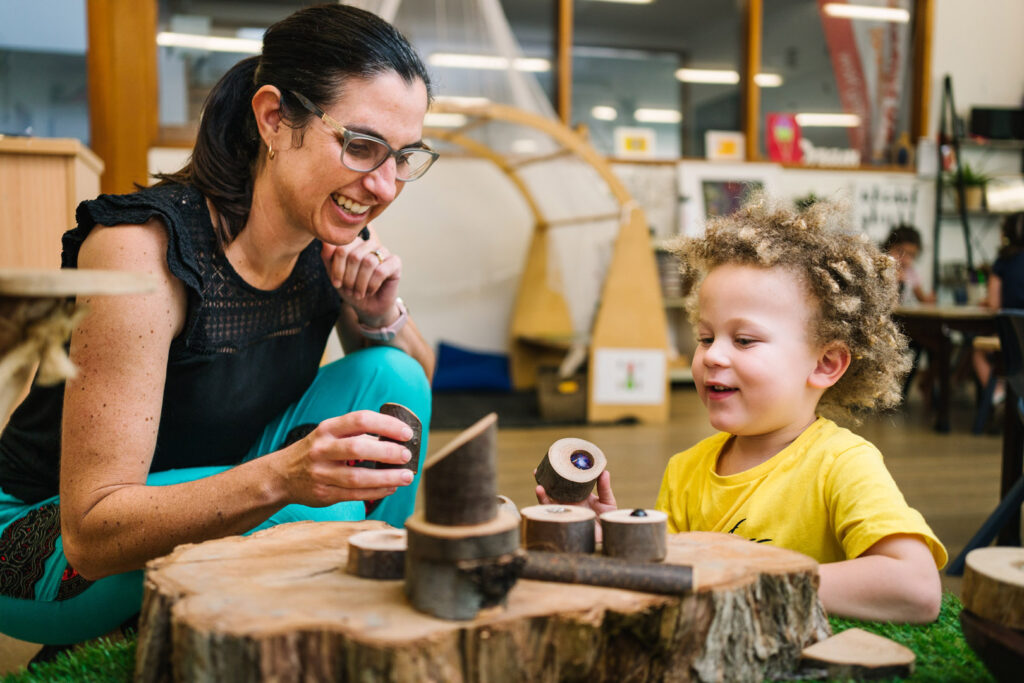 KU Sutherland childcare building blocks with a child