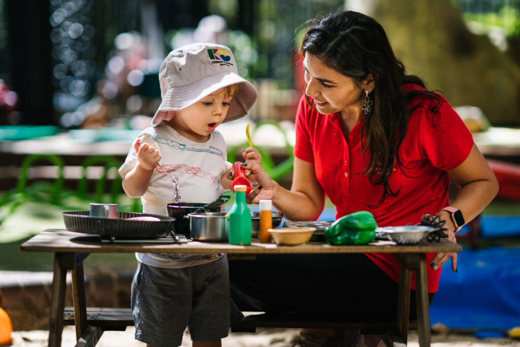 KU Phillip Park childcare educator interacting with a child