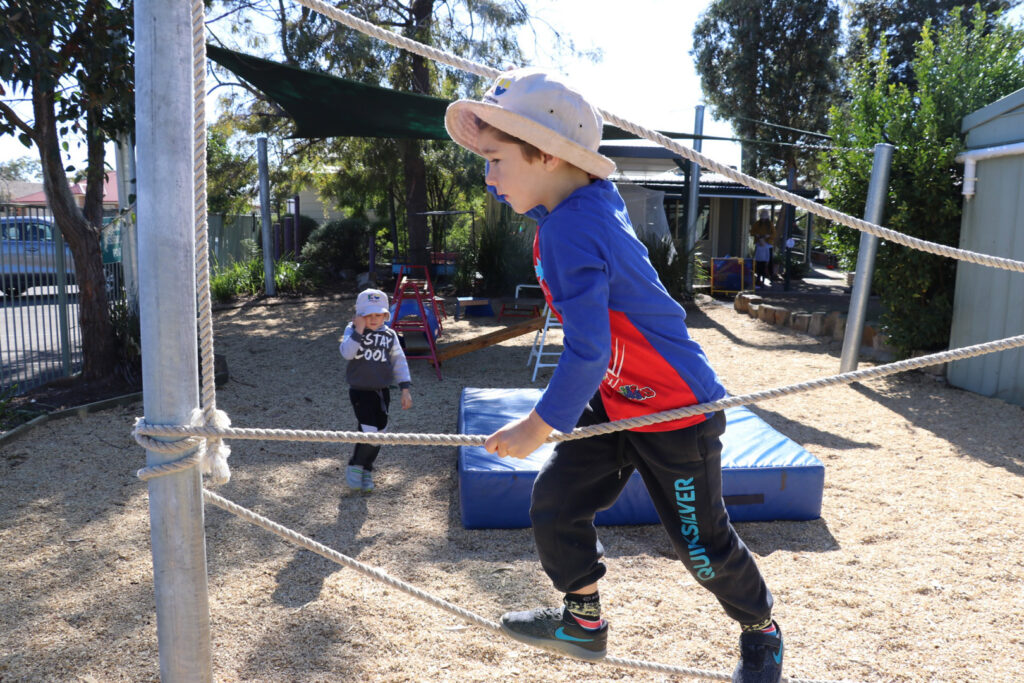 Child climbing ropes at KU Peninsula childcare