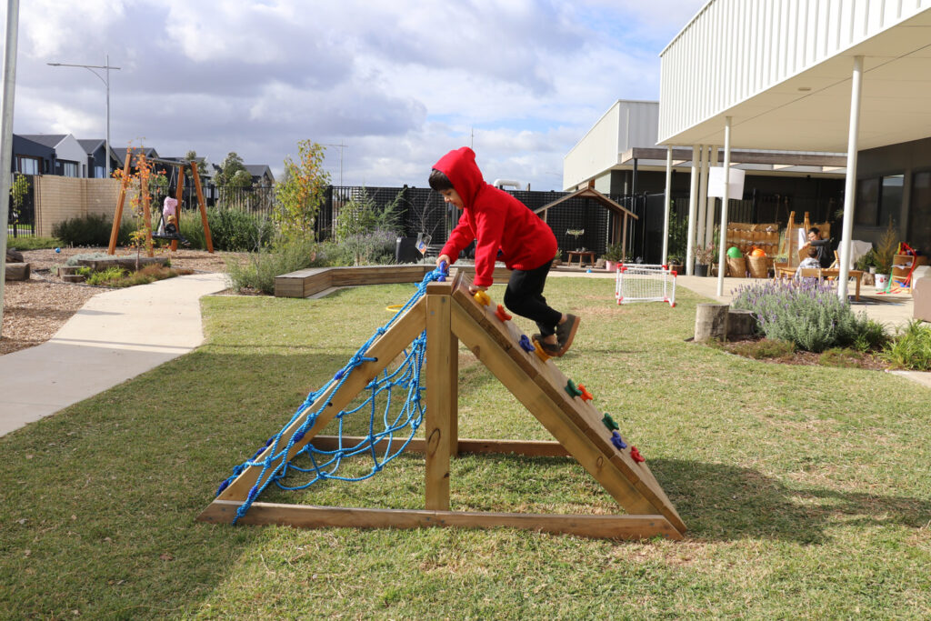 Child playing on the equipment at KU Dianella childcare